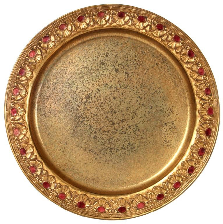 Tiffany Furnaces Dore Enameled Plate: Tiffany Furnaces Dore Enameled Plate. 10.25 in. Diameter dore bronze plate has a leafy border with greek key pattern and red enamel embellishments; signed on base Louis C. Tiffany Furnaces Inc. 317. i