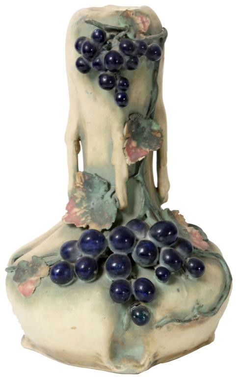 Amphora Edda Series Vase W/ Grapes: Amphora Edda Series Vase W/ Grapes. Has a bulbous body with a cylindrical neck, decorated on the front with 2 clusters of glossy grapes with vines and colorful leaves. Signed with Edda & swastika in t
