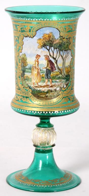 Venetian Glass Painted Chalice: Venetian Glass Painted Chalice. Emerald green glass, gilt decorated with while enamel borders and a painted scenic panel on the front showing a man and woman walking together; has a trumpeted foot app