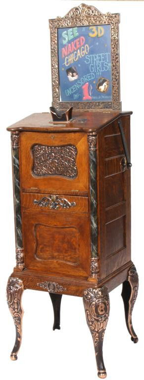 Oak Cal-o-Scope by Chas Fen & Co.: Oak Cal-o-Scope by Chas Fen & Co. Oak case with faux marble half columns with heavy iron mounts on fancy molded cabriole legs; visual lady picture show with provocative rotating cards displays through