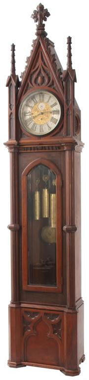 Massive Gothic Grandfather Clock: Massive Gothic Grandfather Clock. The clock has fancy blued hands that have slight surface imperfections, the round dial has a large silvered chapter ring with applied brass Roman hour numerals and bl