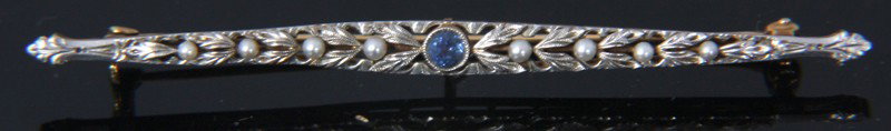 Ladies 2 Tone Gold Pin W/ Sapphires & Pearls: Ladies 2 Tone Gold Pin W/ Sapphires & Pearls. 14K rose gold bar pin overlaid with white gold filigree containing 8 pearls and one bezel set sapphire in the center. 72mm Long; 0.15 oz