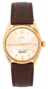 Rolex 14K Gold Oyster Perpetual "25 Years Service / Coca-Cola" Wristwatch, Reference 1005, Circa: Rolex 14K Gold Oyster Perpetual "25 Years Service, Coca-Cola" Wristwatch, Reference 1005, Circa 1966Case: 14K GoldCase Diameter: 34mmReference/Model Number: 1005Movement: Automatic, 26 Jewel