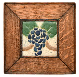 Grueby Faience Company "Grapevine" Tile: Grueby Faience Company(Boston, MA, 1894-1911)"Grapevine" Tilecirca 1900-1910glazed earthenware, oakmarked "Grueby, Boston"5 1/2 x 5 1/2 inches (sight)11 3/4 x 11 3/4 inches (frame)Proven