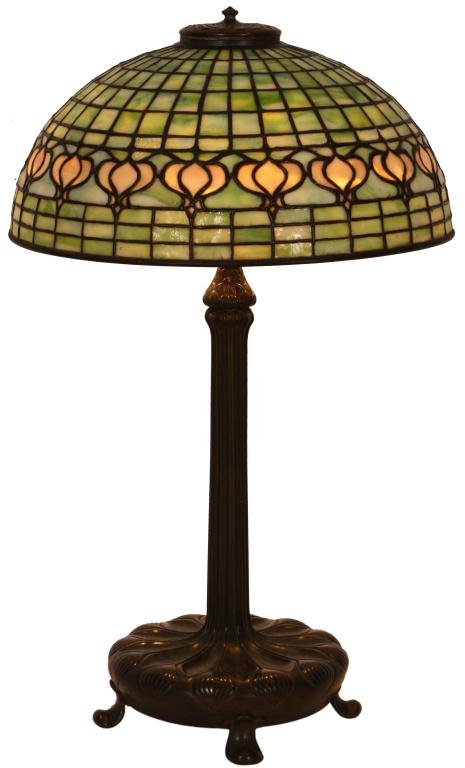 Tiffany Pomegranate Table Lamp: Tiffany Studios Pomegranate Table Lamp. 16 in. domical shade has a geometric brick background in green mottled and striated glass, a golden border containing a string of Tiffany's classic pomegranate 
