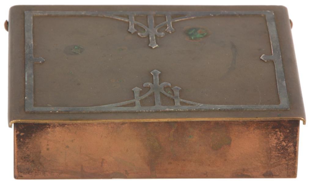 Heintz Bronze & Silver Overlay Box: Heintz Bronze & Silver Overlay Box. Hinged bronze box has silver overlaid decoration on the lid and a wood lined interior. Signed on the bottom; has few tarnish spots. 1 in. high x 4.25 in. x 3.25 in.