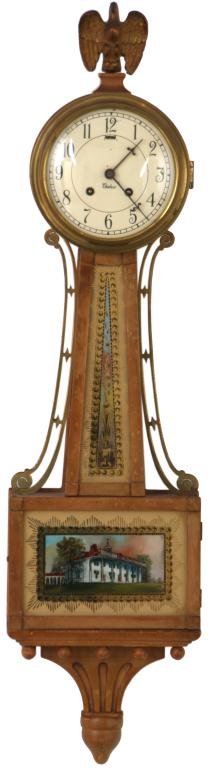 Chelsea Presentation Banjo Clock: Chelsea Presentation Banjo Clock. 5 in. Painted metal dial with black Arabic numbers signed Chelsea, original blued hands (tarnished), ; brass spring driven movement is signed Chelsea Clock Co. Boston
