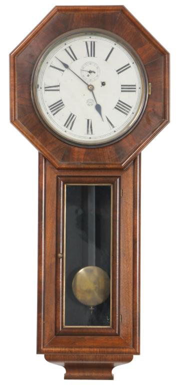New Haven Office No. 2 Wall Clock: New Haven Office No. 2 Wall Clock. 12 in. Painted metal dial with black Roman hour numerals and 2 in. sub- seconds dial, signed New Haven. 8 Day time only, brass weight driven movement has brass cover