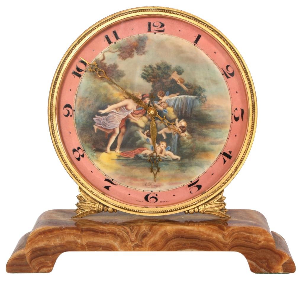 Ivory Dial Desk Clock: Ivory Dial Desk Clock. Large 6 in. painted ivory dial has a classical scene with a man and woman among a group of playful putti, dial has a pink chapter ring with black Arabic numbers and fancy gilt p