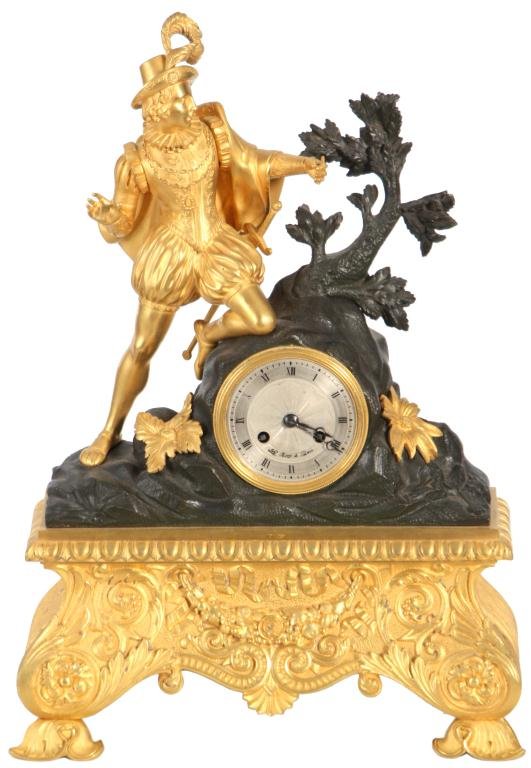 French Figural Silk Thread Mantle Clock: French Figural Silk Thread Mantle Clock. Dore bronze figure of a Spanish explorer, he is well dressed with feathered hat, cape, gold pendant, embroidered clothing and sword at his hip, he holds a bird