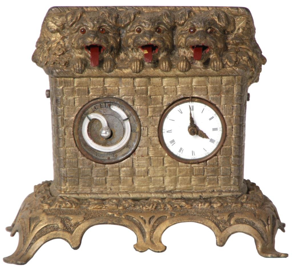 Mayer Animated Dog Desk Clock: Mayer Animated Dog Desk Clock The gilt metal case resembles a woven basket with 3 small puppies poking their heads from the top, they have beaded eyes and their red tongues rock back and forth in a pa