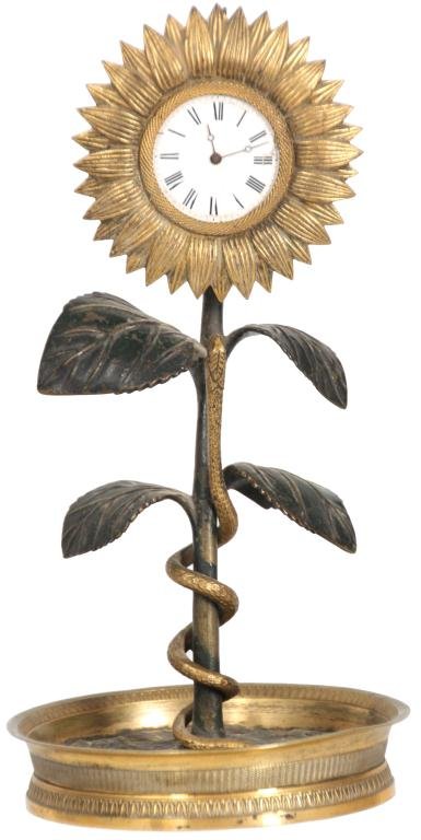 Bronze Sunflower Desk Clock: Bronze Sunflower Desk Clock. Dore and cold painted bronze sunflower has a long green stem with leaves, wrapped with a serpent, the blooming flower on top is centered with a 1.5 in. porcelain dial with