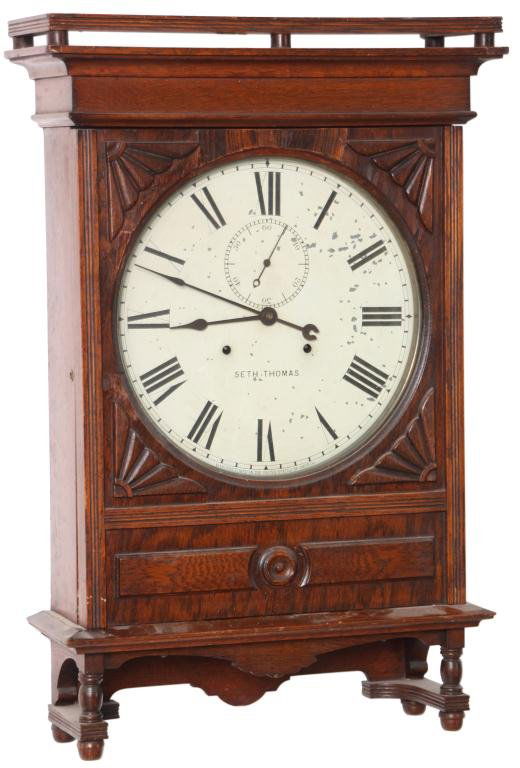 Seth Thomas 14 in. Lobby Clock: Seth Thomas 14 in. Lobby Clock. 14 in. painted metal dial has black Roman hour numerals, sub seconds dial and black spade hands, signed on dial; quality brass, time only, double spring, 30 day movemen