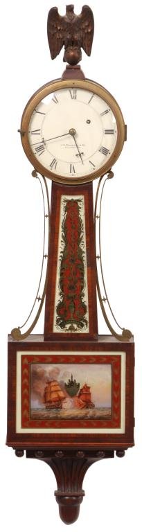 Waltham Presentation Banjo Clock: Waltham Presentation Banjo Clock. 7 in. painted metal dial with black Roman hour numerals, signed J.E. Caldwell & Co. Philadelphia, fancy blued hands; quality weight driven, brass movement signed Walt