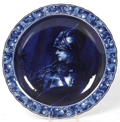 16 in. Delft Rembrandt Charger: 16 in. Delft Rembrandt Charger. Cobalt blue portrait of a armored soldier holding a lance; signed on the left side After Rembrandt, delft marks on the back. In good condition with no chips, cracks, br