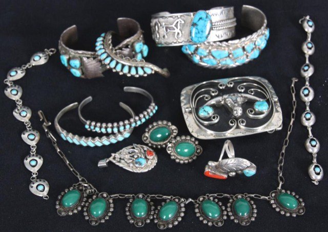 11 Pcs. Sterling Silver Jewelry: 11 Pcs. Sterling Silver Jewelry. Assorted Native American style jewelry pieces with green and blue turquoise and red coral stones. 6 Bangle bracelets, 2 chain link bracelets, ring, pendant, buckle, ne
