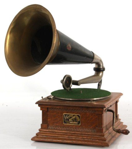 Oak Victor Type-M Victrola: Oak Victor Type-M Victrola. Oak case with brass horn, has original Victor Talking Machine decal on horn and brass tag with serial No. 43438. In good condition, turn table spins and stops, spring winds
