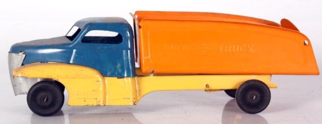 Buddy-L Dump Truck: Buddy-L Dump Truck. Has a painted blue and yellow cab and yellow frame with an orange bucket on the back; wood wheels. In good overall condition. 5.5 in. high x 17 in. x 5 in.