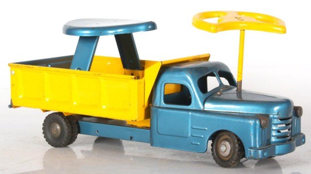 Structo Ride-em Dump Truck: Structo Ride-em Dump Truck. Riding toy dump truck with mounted seat and steering wheel; good old blue and yellow paint has some typical wear. 10 in. high x 20.5 in. x 8 in.