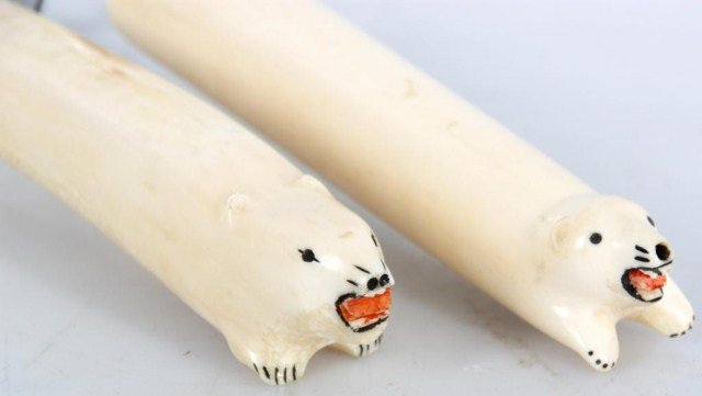 Alaskan 2 Pc. Carved Bone Carving Set: Alaskan 2 Pc. Carved Bone Carving Set. Carved figural polar bear handles with painted embellishments, includes steel and meat fork. 12 in. long