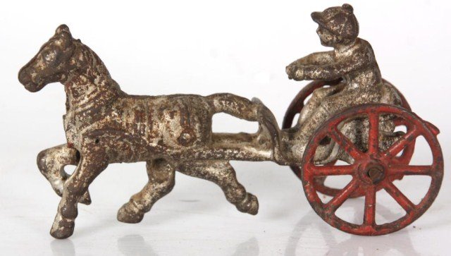 Cast Iron Toy Chariot: Cast Iron Toy Chariot. Has some pitting and paint loss, no breaks or repairs. 5 in. long.