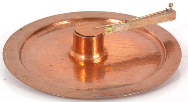 2 Pcs. Roycroft Hammered Copper.: 2 Pcs. Roycroft Hammered Copper. Fancy chafing burner with wood handle and a 14 in. dia tray; both have a polished finish and are in very good condition with "orb and cross" mark on the bottom.