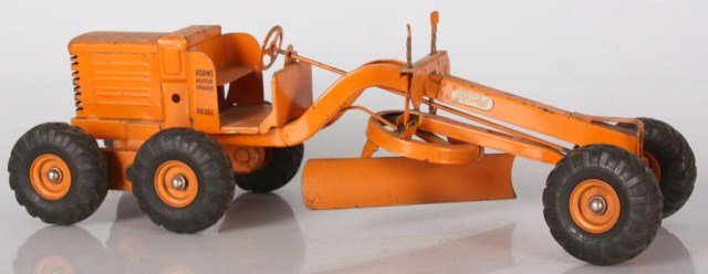 Doepke Toy Grader Tractor: Doepke Toy Grader Tractor. Good original orange paint, Adams Motor Grader Diesel label on the side; decal on front reads, The Charles Wm. Doepke Mfg. Co. Model Toys. In good overall condition with typ