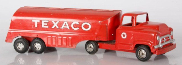 Buddy-L Texaco Truck: Buddy-L Texaco Truck. Red tractor and trailer with white and black lettering decals, plastic Buddy L wheels. Moline pressed Steel Corp manufacturers label on bottom. Original condition, 6 in. high x 2