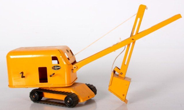 Wyandotte Toys Backhoe: Wyandotte Toys Backhoe. Original yellow paint in good condition with Wyandotte decals, wood wheels with rubber tracks. 8 in. high x 20 in. x 4.5 in.