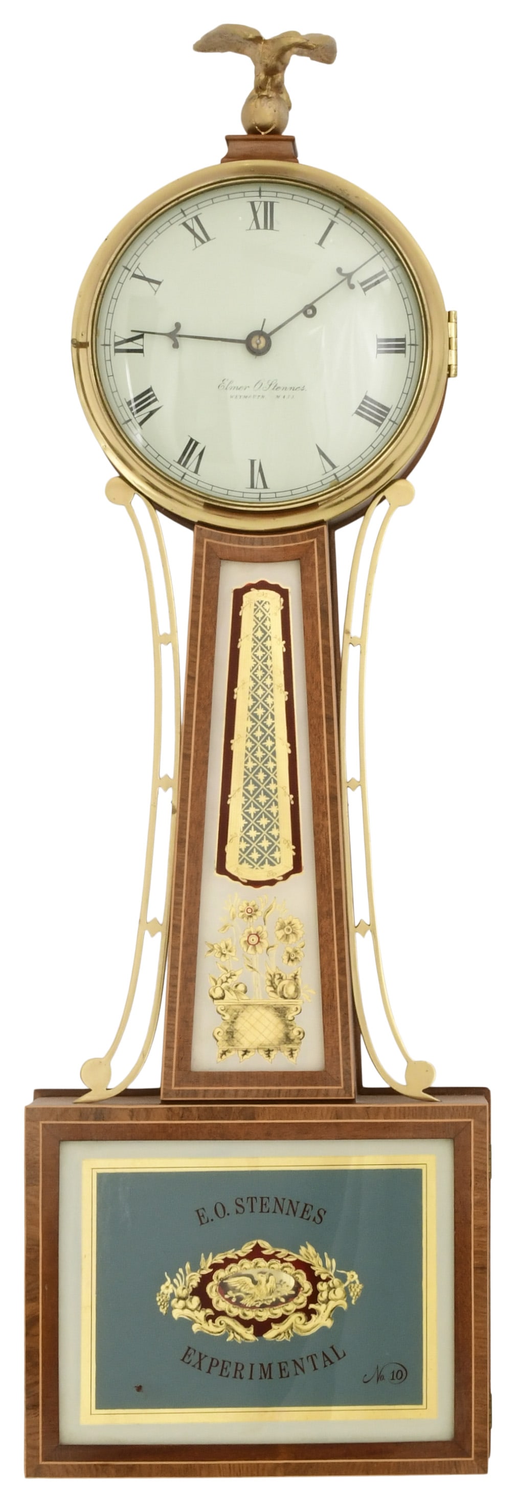 Elmer O. Stennes Experimental Banjo Clock, Pembroke, Massachusetts: Elmer O. Stennes Experimental Banjo Clock, Pembroke, Massachusettscirca 1974mahogany case with cross banded frames and reverse painted tablets, brass 8-day weight-driven movement, signed on the moveme