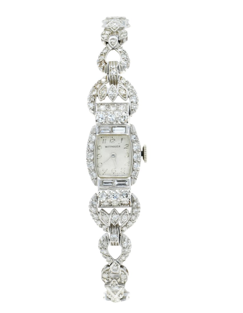 Wittnauer Platinum & Diamond Ladies Wristwatch: Wittnauer Platinum & Diamond Ladies Wristwatch Case: Platinum, set with baguette and single cut diamonds weighing a total of 3.01 carats Case Width: 14.20 mm Dial: silvered, Arabic numerals, baton han