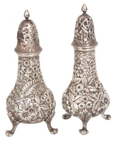 Pr. Sterling Silver Repousse Shakers: Pr. Sterling Silver Repousse Shakers. Manufactured by Hennegan Bates & Co. and Retailed by Ryland & Rankin; decorated with beautiful summer flowers and leaves, has a teardrop form, domical tops with f