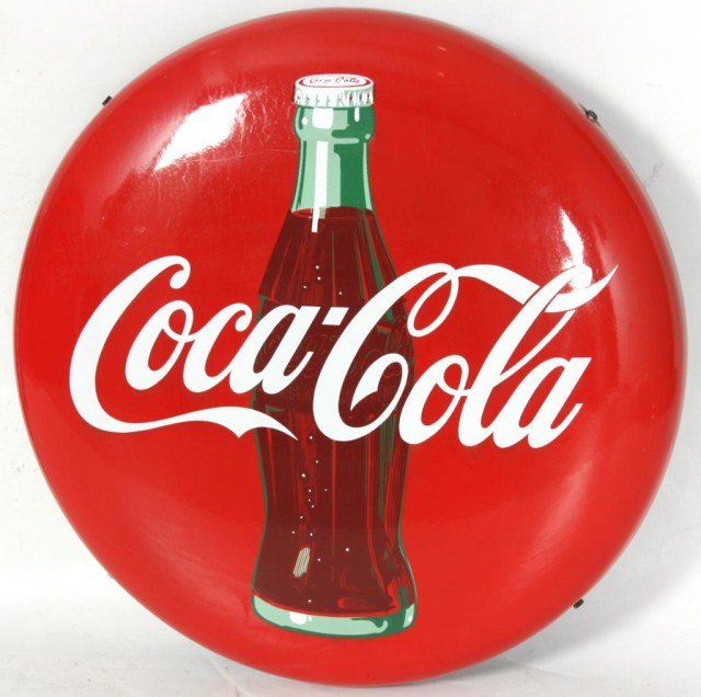 Coca-Cola Round Advertising Sign: Coca-Cola Round Advertising Sign. A round form with a domical front; classic red background and white Coca-Cola lettering across the front of a glass bottle. Enamel is in very good condition with only