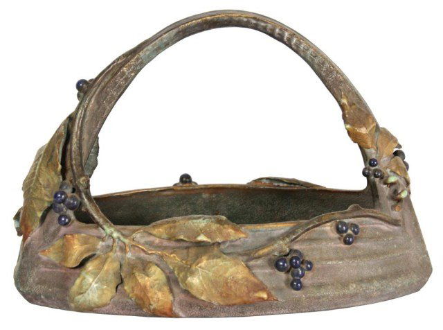 Amphora Pottery Basket with Handle: Amphora Austrian Pottery Basket with Handle. Has an arched handle and is wrapped with a branch, with leaves and berry clusters; in the style of Amphora, has a few minor leaf chips, but no major breaks