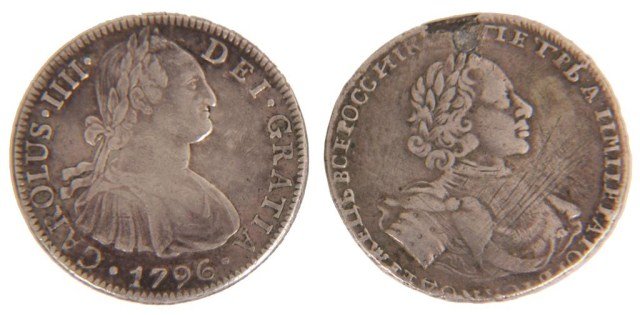 2 Antique Silver Continental Coins: 2 Antique Silver Continental Coins. One Spanish 8 Reale coin with Carolus iiii on the obverse and dated 1796; the second is a rare Russian Empire rouble in silver, portrait of The Tsar Peter I, it is 