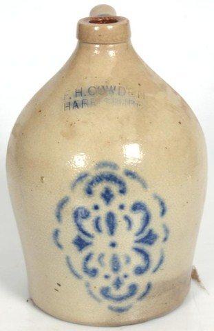 1 Gallon Stoneware Cobalt Jug: Signed F.H. Cowden, Harrisburg, has nice cobalt design on the front. 1 Gallon, 11 in. high. No chips.