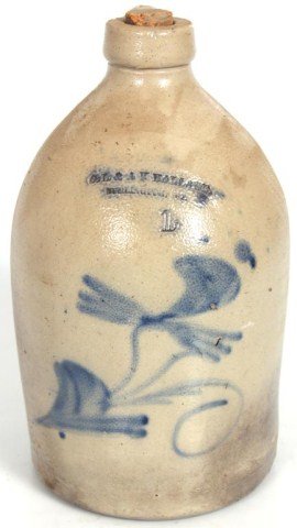 1 Gallon Stoneware Cobalt Jug: Signed O.L. & A.K. Ballard Burlington Vt; decorated with blue cobalt design on the front. 1 Gallon, 12.5 in. high. No Chips, firing flaw at bottom.