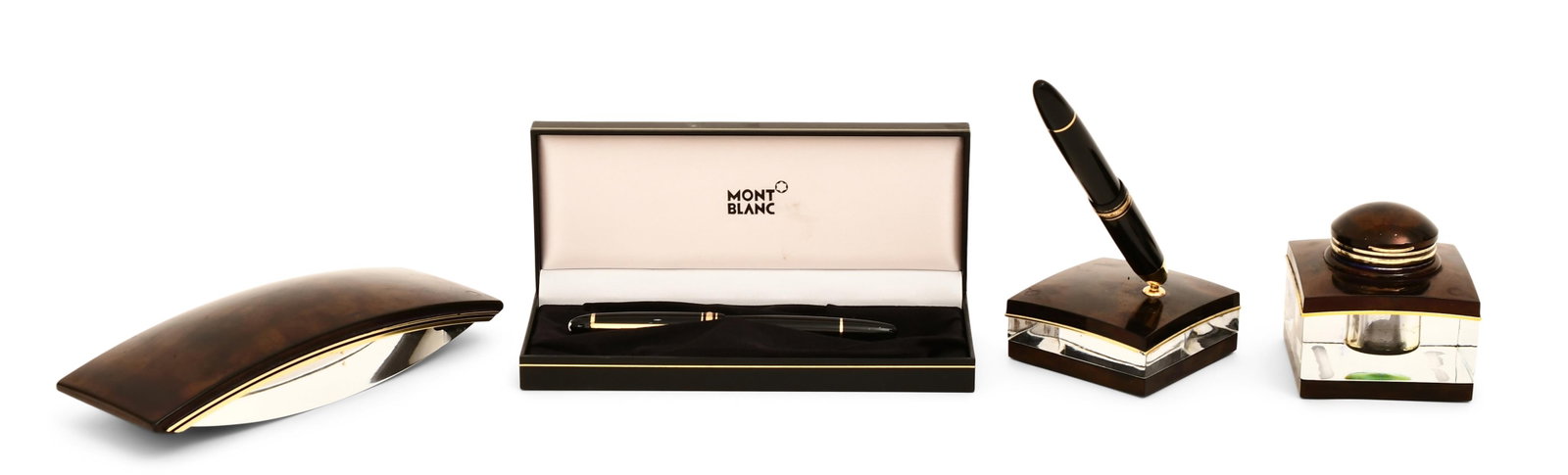 Montblanc Inkwell, Rocker Blotter, Pen Holder and Two Pens: Montblanc Inkwell, Rocker Blotter, Pen Holder and Two Pens 3 x 3 x 3 inches (inkwell) Other Notes: Fontaine's Auction Gallery can arrange shipping for this item (USA only).