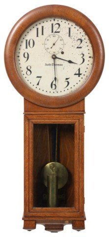 Oak Seth Thomas No. 2 Regulator: Oak Seth Thomas No. 2 Regulator. 12 in. painted metal dial with black Arabic numbers, 3 in. sub seconds dial, some chipping to dial, signed Seth Thomas; brass weight driven movement No. 77A has pyrami