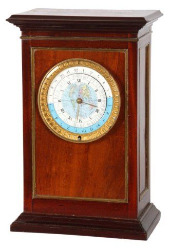 Fancy Mahogany World Time Clock: Fancy Mahogany World Time Clock. Enamel 4.5 in. dial has black Roman hour numerals on the chapter ring, a colorful map in the center and popular world locations outside; the outer ring has a day-night