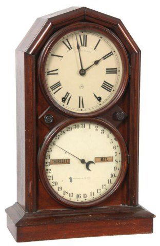 Seth Thomas Double Dial Clock: Seth Thomas Double Dial Parlor Calendar Clock No. 5. 8 in. upper time dial with black Roman hour numerals, spade hands, 8 in. lower calendar dial with 31 date Arabic numbers with month & day apertures
