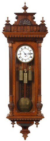3 Weight Vienna Regulator Clock: 3 Weight Vienna Regulator Clock. 6.5 in. sunken porcelain dial with brass bezel, Roman hour numerals and fancy pierced hands; 3 weight driven movement has brass plates, quarter hour grand sonnerie str