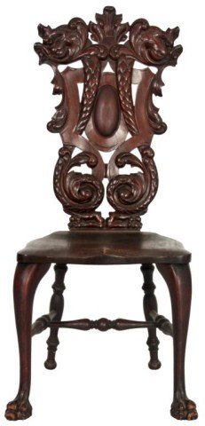Stickley & Brandt Carved Mahogany Chair: Stickley & Brandt Carved Mahogany Chair. Pierced carved back panel with figural dolphin heads at the crest, having long scaled serpent-like necks, scrolling at the bottom under a central oval medallio