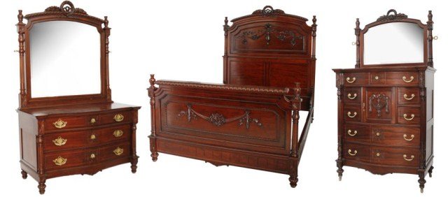 3 Pc Carved Mahogany Bedroom Set.: 3 Pc Carved Mahogany Bedroom Set. Garland and wreath crests, shaped panels with drapery carvings, fluted columns and reeded legs. The set has a queen size bed, ladies dresser and gent's chest with hat