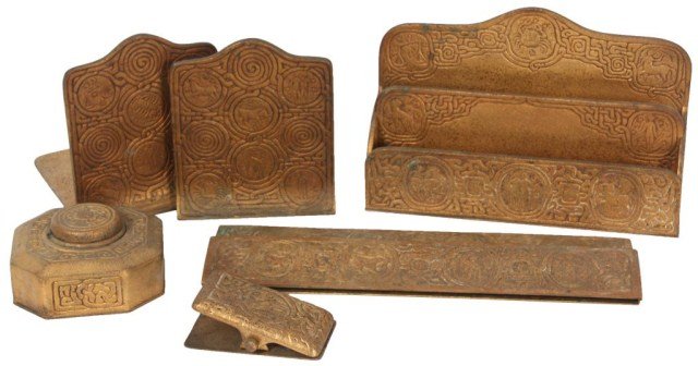 5 Pc. Tiffany Studios Zodiac Desk Set: 5 Pc. Tiffany Studios Dore Bronze Zodiac Desk Set. Includes letter rack No. 1009, Bookends No. 1091, Blotter ends No. 994, Paper Clip No. 1080 & Inkwell no. 842. Set is in very good condition with a g