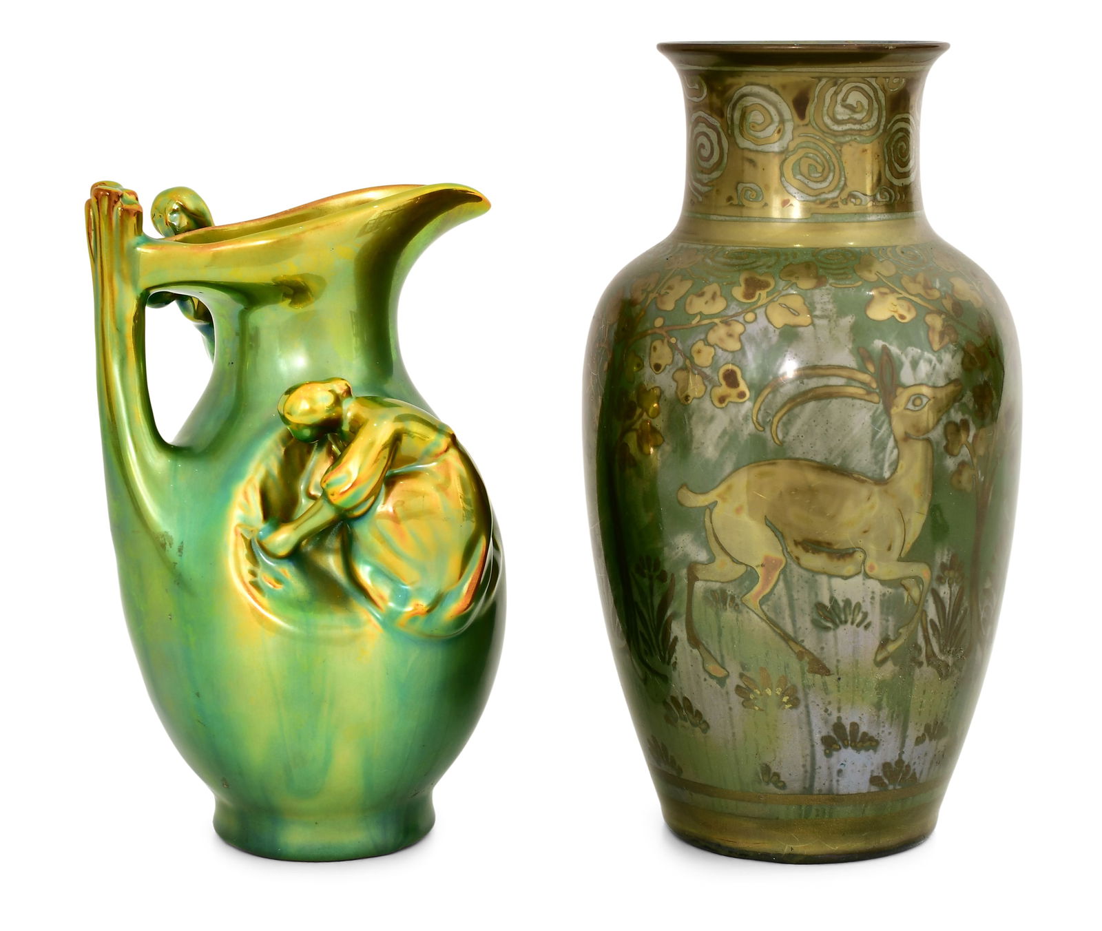 An English Pottery Vase and a Zsolnay Hungarian Pottery Ewer: An English Pottery Vase and a Zsolnay Hungarian Pottery Ewerearly 20th centurythe ewer decorated with two figures and the vase with a deer, each marked to the underside7 1/2 x 3 3/4 inches (ewer)6 1/4