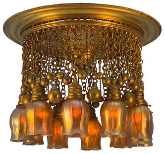 Tiffany Studios Ten-Light "Moorish" Chandelier: Tiffany StudiosTen-Light "Moorish" Chandeliercirca 1905favrile glass, gilt bronzeeach shade engraved "L.C.T. Favrile"16 1/2 x 23 inchesProvenance: Property from an Important Midwest Collection