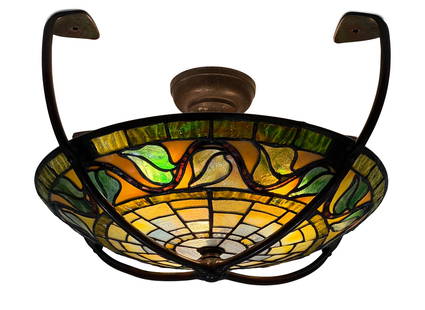 Tiffany Studios "Swirling Leaf" Ceiling Light: Tiffany Studios"Swirling Leaf" Ceiling Lightcirca 1905leaded glass, patinated bronzeimpressed "Tiffany Studios, New York" and with the Tiffany Glass & Decorating Co. monogram9 x 15 3/4 inchesProvenanc