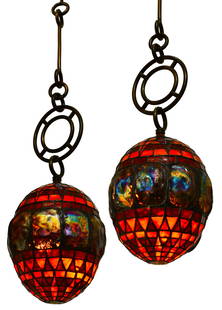 Tiffany Studios, A Rare & Early Pair of "Turtle-Back" Lanterns: Tiffany StudiosA Rare & Early Pair of "Turtle-Back" Lanternscirca 1895leaded glass, favrile glass, bronze12 in. high x 10 in. diameter (lantern only)50 in. dropLouis Comfort Tiffany was a master in hi