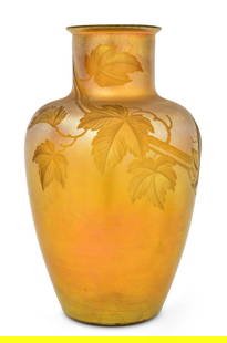 Tiffany Studios Intaglio Carved Favrile Glass "Leaf & Vine" Vase: Tiffany Studios"Leaf & Vine" Vasecirca 1910intaglio carved favrile glassengraved "L.C. Tiffany - Favrile, Inc."12 1/2 x 7 1/2 inchesProvenance: Property from an Important West Coast Collection